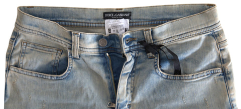 Blue washed cotton mid-waist skinny jeans by Dolce & Gabbana, showing the fitted denim with subtle fading and classic five-pocket design.