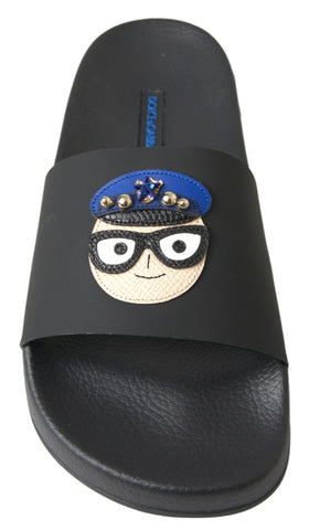 Black Dolce & Gabbana slides sandals with beach-ready design, featuring slip-on style and Saint Barth-inspired footwear.