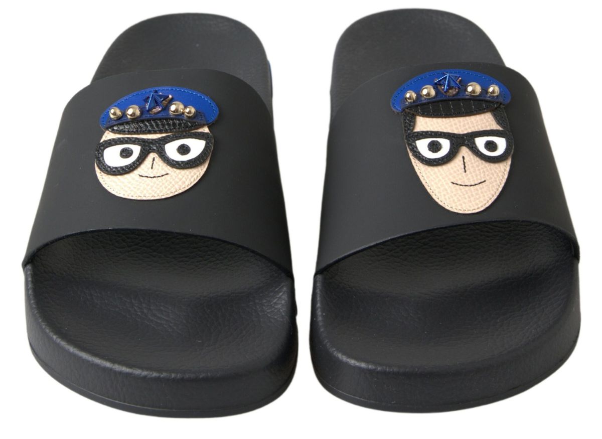 Black Dolce & Gabbana slides sandals with beach-friendly design and Saint Barth-inspired style, featuring sleek, comfortable footwear.