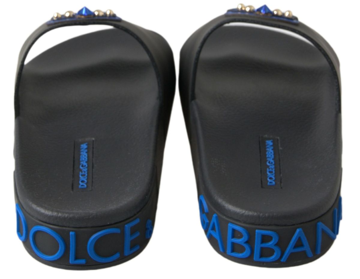 Black Dolce & Gabbana slide sandals with beach-style straps, perfect for casual summer wear.