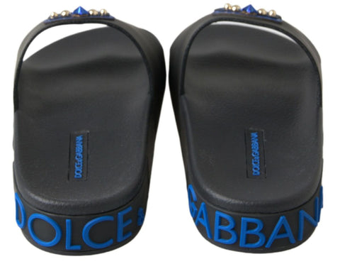 Black Dolce & Gabbana slide sandals with beach-style straps, perfect for casual summer wear.