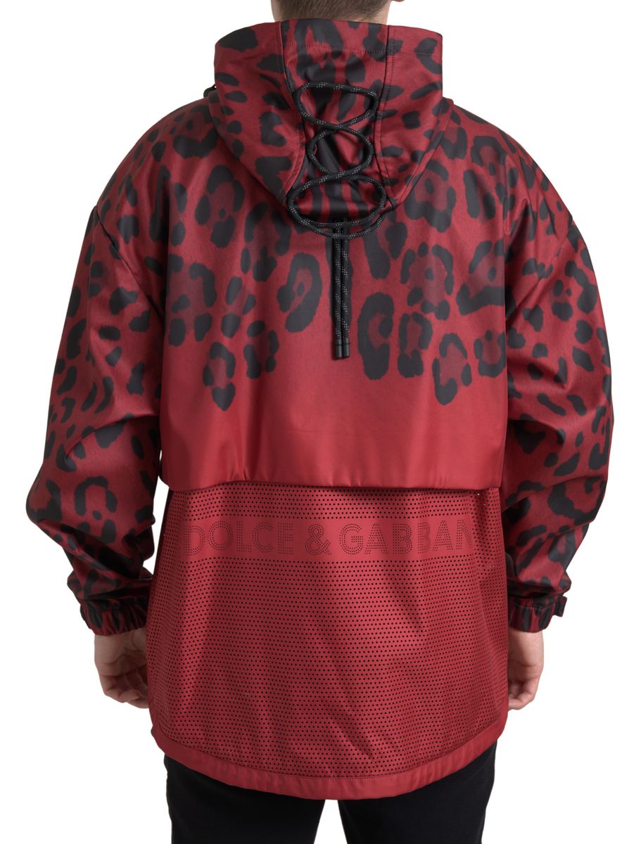 Red leopard print hooded rain coat by Dolce & Gabbana, front view showing waterproof fabric and stylish design.