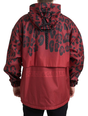 Red leopard print hooded rain coat by Dolce & Gabbana, front view showing waterproof fabric and stylish design.