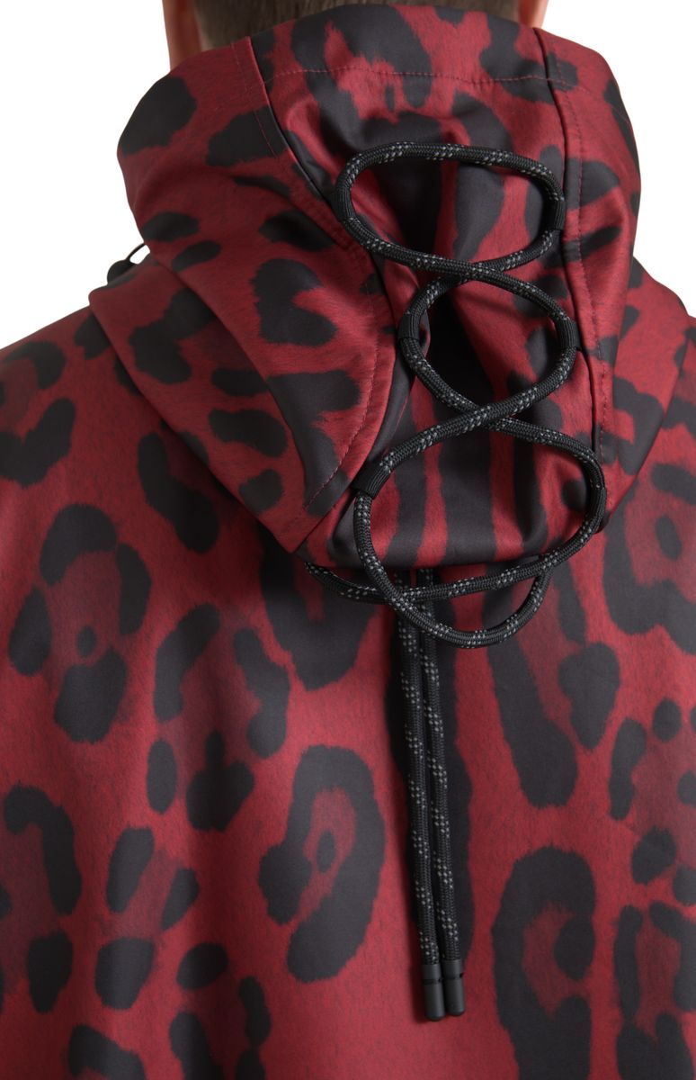 Red leopard print hooded rain coat jacket by Dolce & Gabbana, featuring a stylish hood and vibrant animal print design.