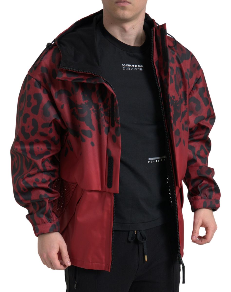 Red leopard print hooded rain coat jacket by Dolce & Gabbana, featuring a stylish waterproof design with a hood and bold pattern.