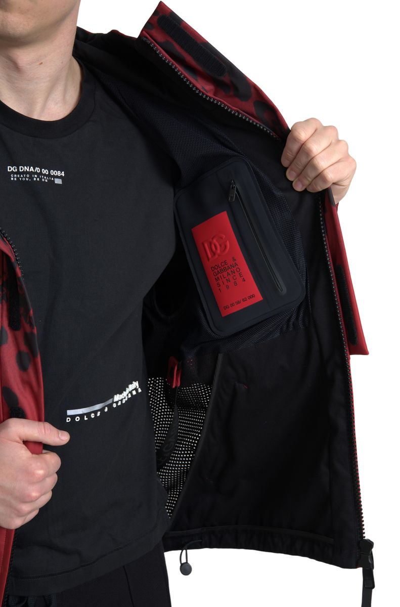 Red leopard print hooded rain coat jacket by Dolce & Gabbana, featuring a stylish waterproof design and bold pattern.