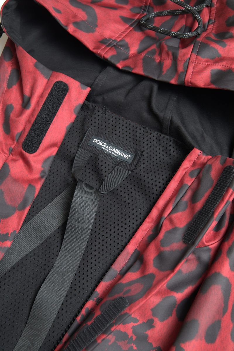 Red leopard print hooded rain coat jacket by Dolce & Gabbana, featuring a stylish, waterproof design with a hood and bold pattern.