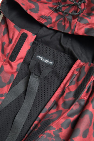 Red leopard print hooded rain coat jacket by Dolce & Gabbana, featuring a stylish, waterproof design with a hood and bold pattern.