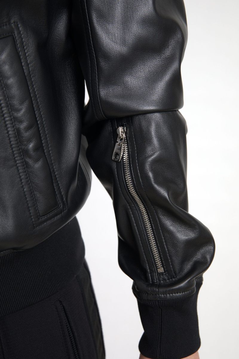 Black leather full-zip bomber jacket for men by Dolce & Gabbana, featuring a sleek design and ribbed cuffs.