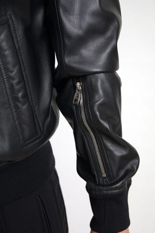 Black leather full-zip bomber jacket for men by Dolce & Gabbana, featuring a sleek design and ribbed cuffs.