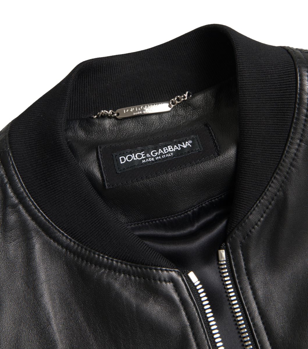 Black leather full-zip bomber jacket for men by Dolce & Gabbana, featuring a sleek design and ribbed collar, cuffs, and hem.