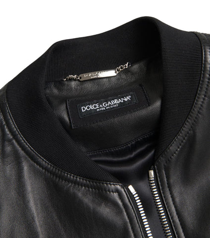 Black leather full-zip bomber jacket for men by Dolce & Gabbana, featuring a sleek design and ribbed collar, cuffs, and hem.