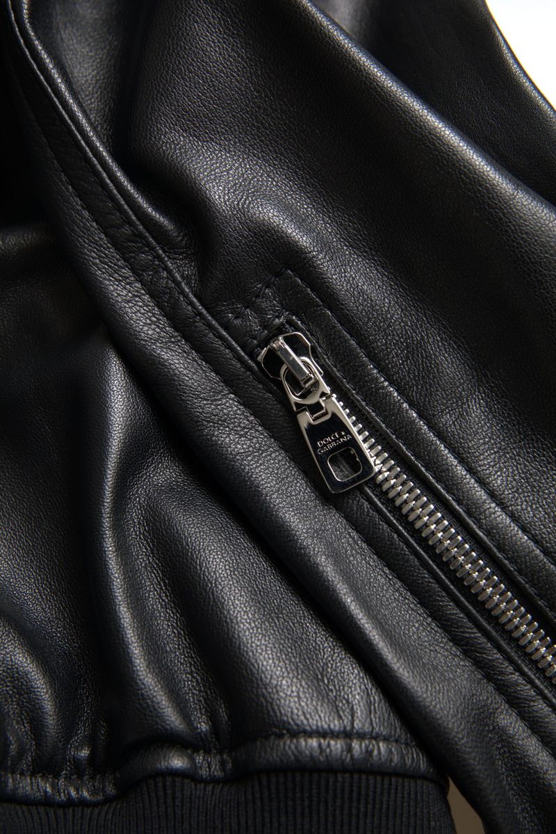 Black leather full-zip bomber jacket for men by Dolce & Gabbana, featuring a sleek design with a front zipper and ribbed cuffs.