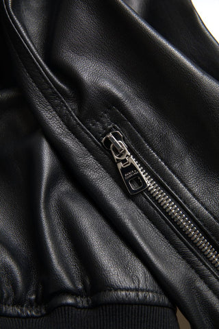 Black leather full-zip bomber jacket for men by Dolce & Gabbana, featuring a sleek design with a front zipper and ribbed cuffs.