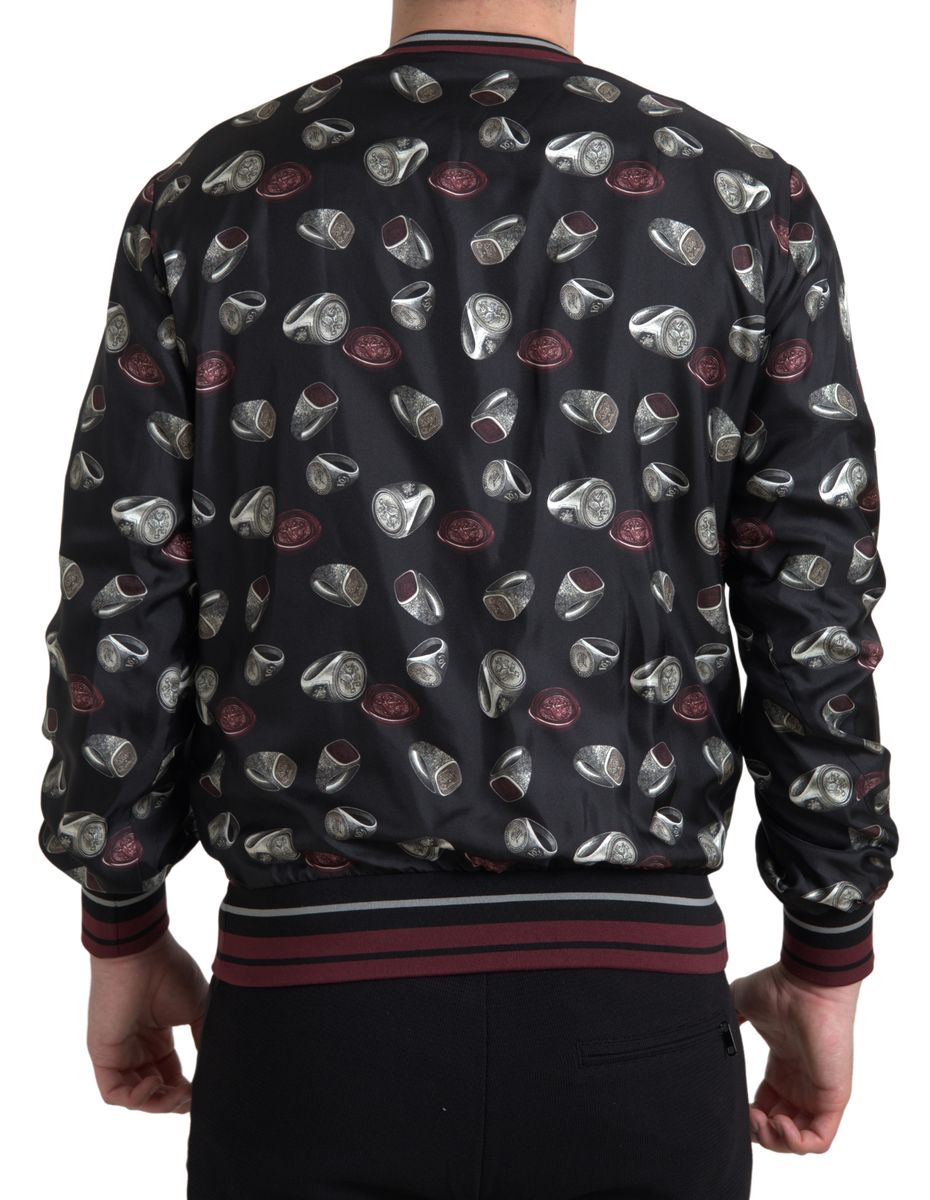 Black silk crewneck sweater with ring print design by Dolce & Gabbana, featuring a relaxed fit and stylish long sleeves.