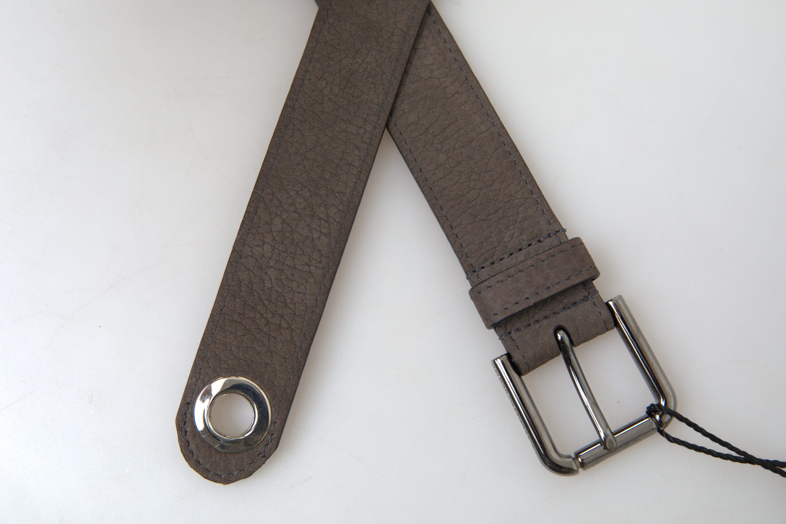 Brown leather men's belt with metal buckle by Dolce & Gabbana, featuring a sleek design and adjustable strap.