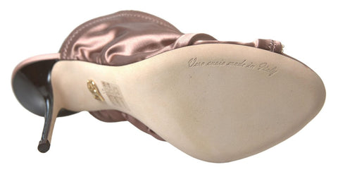 Light brown Dolce & Gabbana slingback stiletto heels with corset-style fastening and elegant design.