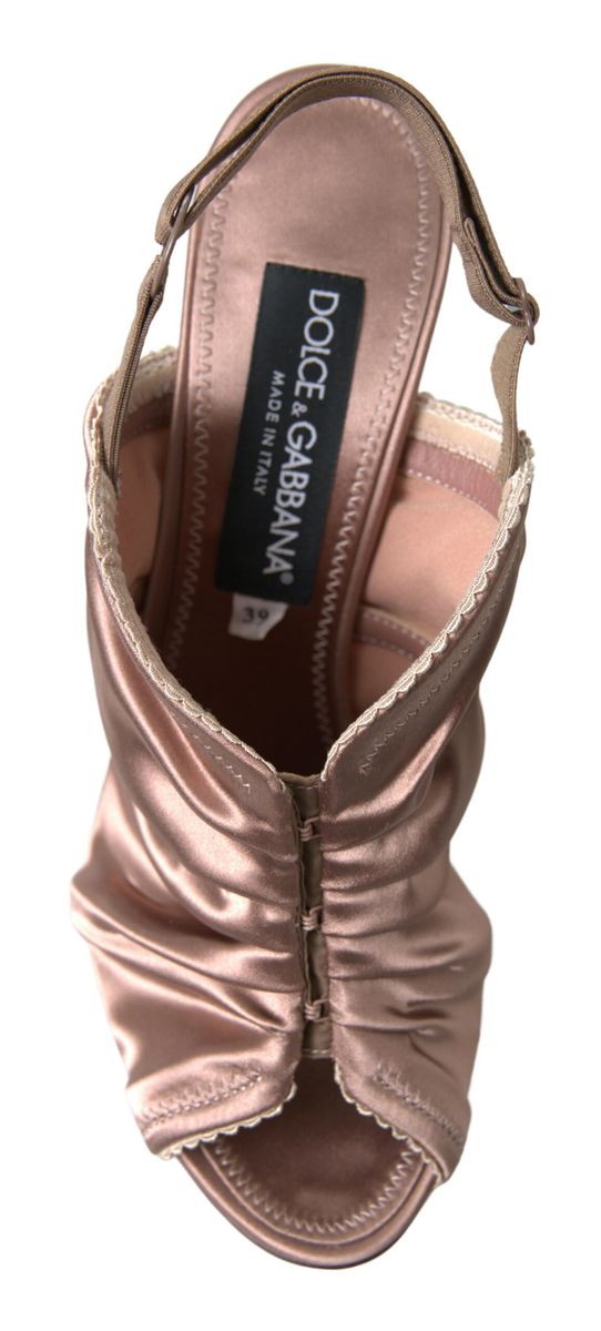Light brown slingback stiletto heels with corset-style fastening from Dolce & Gabbana, featuring elegant design details.