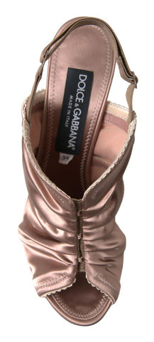 Light brown slingback stiletto heels with corset-style fastening from Dolce & Gabbana, featuring elegant design details.