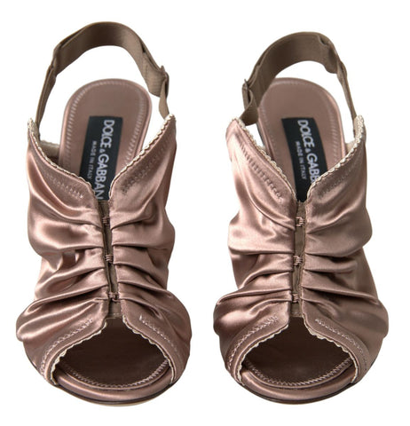 Light brown slingback stiletto heels with corset-style fastening by Dolce & Gabbana, featuring elegant design and sleek silhouette.