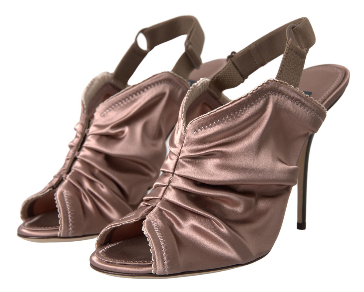 Light brown Dolce & Gabbana slingback stiletto heels with corset-style fastening and elegant design.