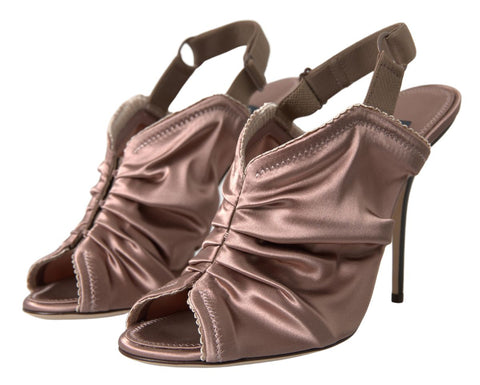 Light brown Dolce & Gabbana slingback stiletto heels with corset-style fastening and elegant design.