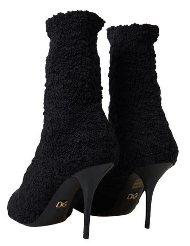 Black Dolce & Gabbana stiletto heels and mid-calf boots with sleek design and pointed toes, stylish footwear for elegant fashion.