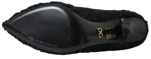 Black stiletto heels and mid-calf boots by Dolce & Gabbana, featuring sleek design and pointed toes.