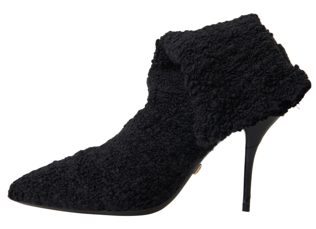 Black Dolce & Gabbana stiletto heels mid-calf boots, featuring sleek design and pointed toes, shown from the side.
