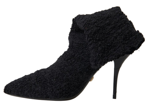 Black Dolce & Gabbana stiletto heels mid-calf boots, featuring sleek design and pointed toes, shown from the side.
