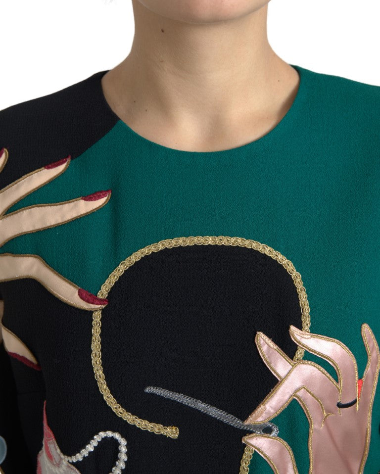 Multicolor Dolce & Gabbana long sleeve A-line maxi dress with flowing fabric and vibrant pattern, displayed on a hanger.