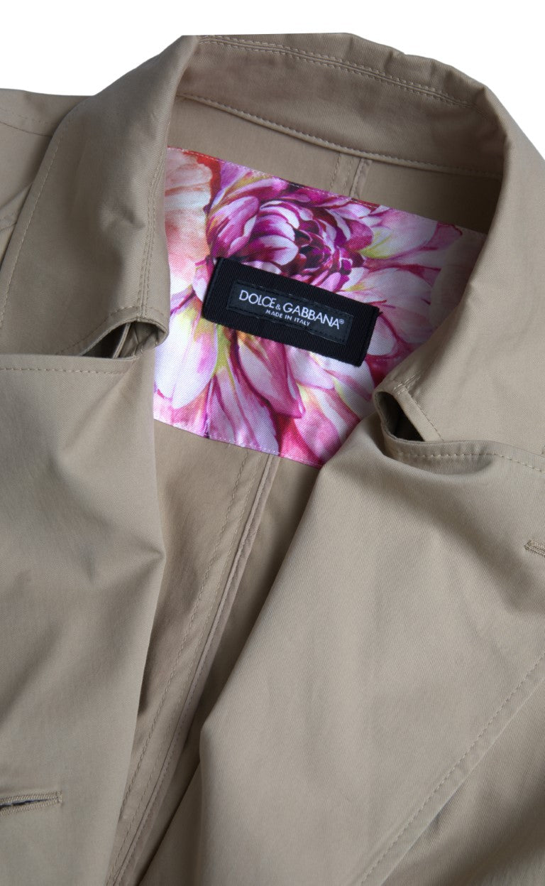 Dolce & Gabbana khaki double-breasted trench coat jacket with classic collar, button details, and belted waist.