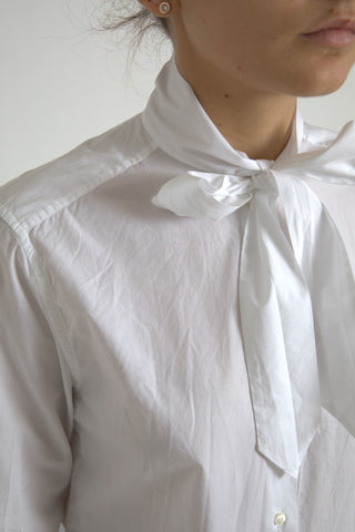 White cotton long-sleeve ascot collar top by Dolce & Gabbana, featuring a classic, elegant design.