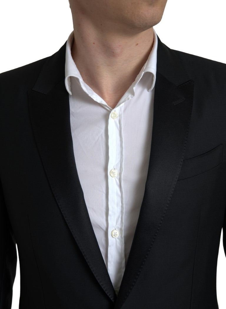 Black wool single-breasted Martini blazer by Dolce & Gabbana, shown on a mannequin with lapels and button details.