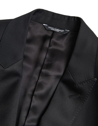 Black wool single-breasted Martini blazer by Dolce & Gabbana, shown on a hanger with detailed buttons and tailored fit.