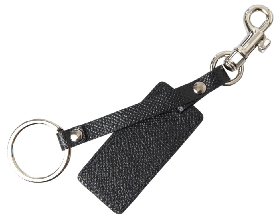 Black leather keychain with silver metal D&G logo, featuring Dolce & Gabbana branding and a sleek, stylish design.