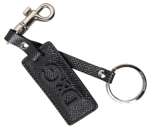 Black leather keychain with silver metal DG logo from Dolce & Gabbana, featuring a sleek and stylish design.