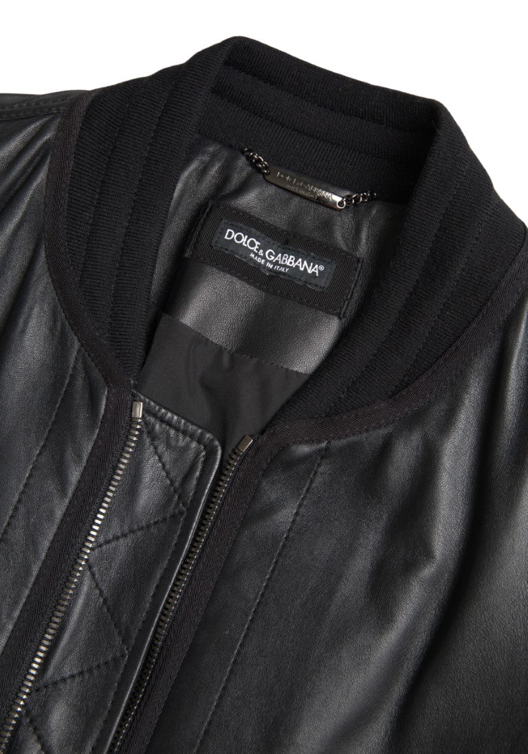 Black leather blouson full-zip bomber jacket by Dolce & Gabbana, shown on a mannequin with ribbed collar and cuffs.