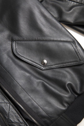 Dolce & Gabbana black leather blouson bomber jacket with full zip, stylish and sleek design, displayed on a hanger.