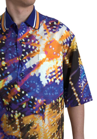 Dolce & Gabbana men's Luminaire print cotton polo top, front view showing vibrant design and classic collar.