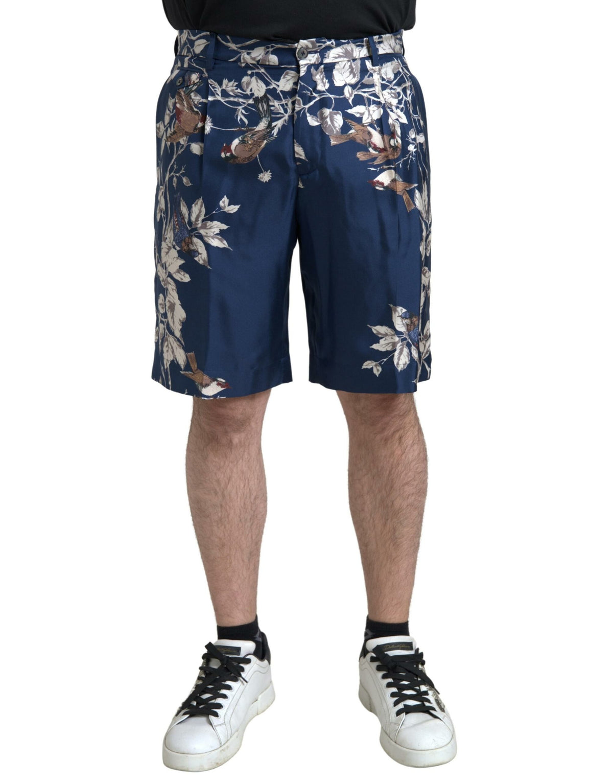 Blue floral print silk Bermuda shorts for men by Dolce & Gabbana, featuring a stylish floral pattern and tailored fit.
