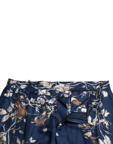 Blue floral print silk men's Bermuda shorts by Dolce & Gabbana, featuring a relaxed fit and stylish design.