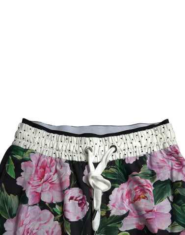 Multicolor peony print cotton joggers for men, stylish Dolce & Gabbana pants with a comfortable fit and vibrant floral design.