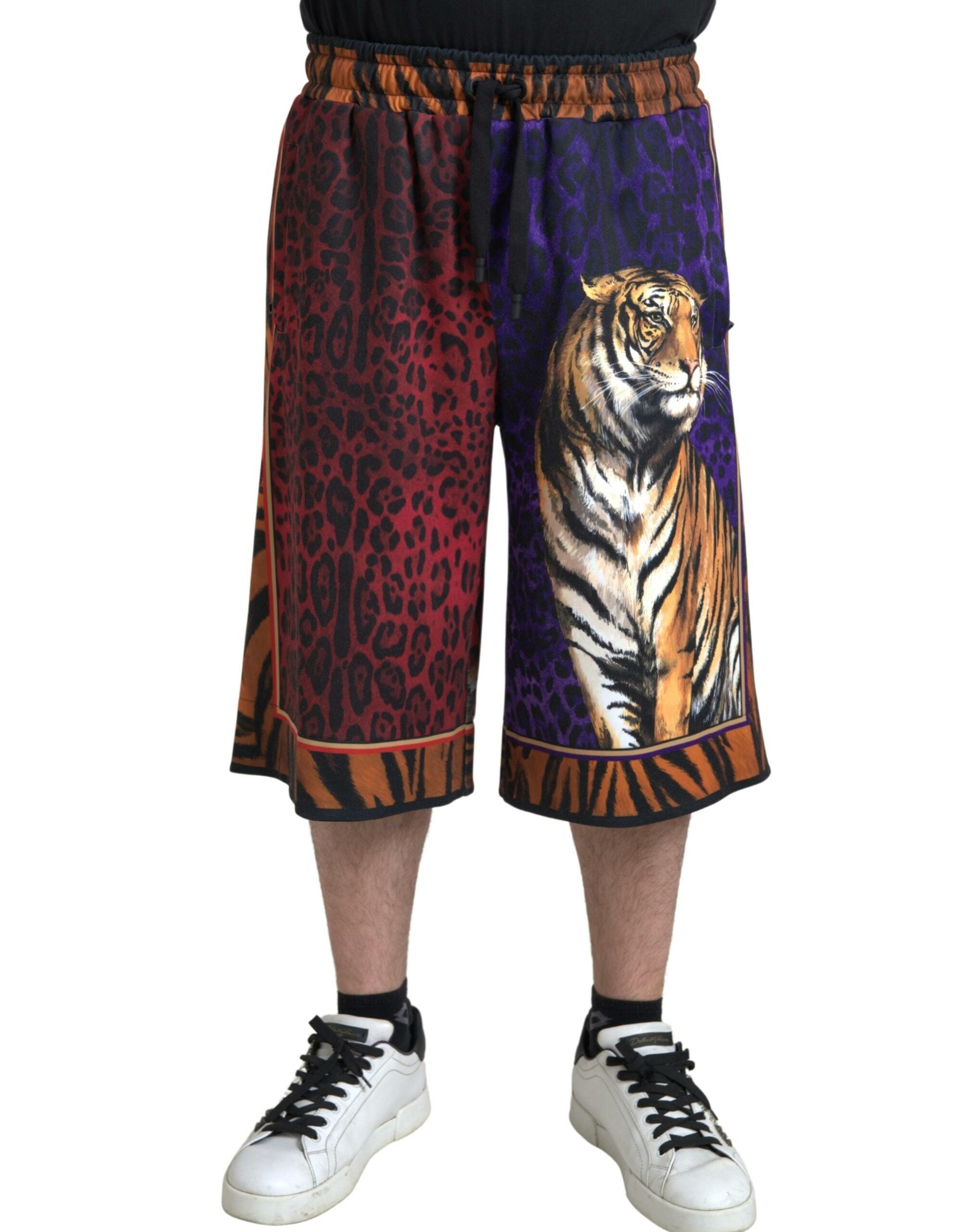 Multicolor tiger print men's Bermuda shorts by Dolce & Gabbana, featuring bold tiger pattern and casual fit.