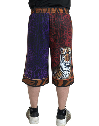Multicolor tiger print men's Bermuda shorts by Dolce & Gabbana featuring vibrant tiger pattern and casual fit.
