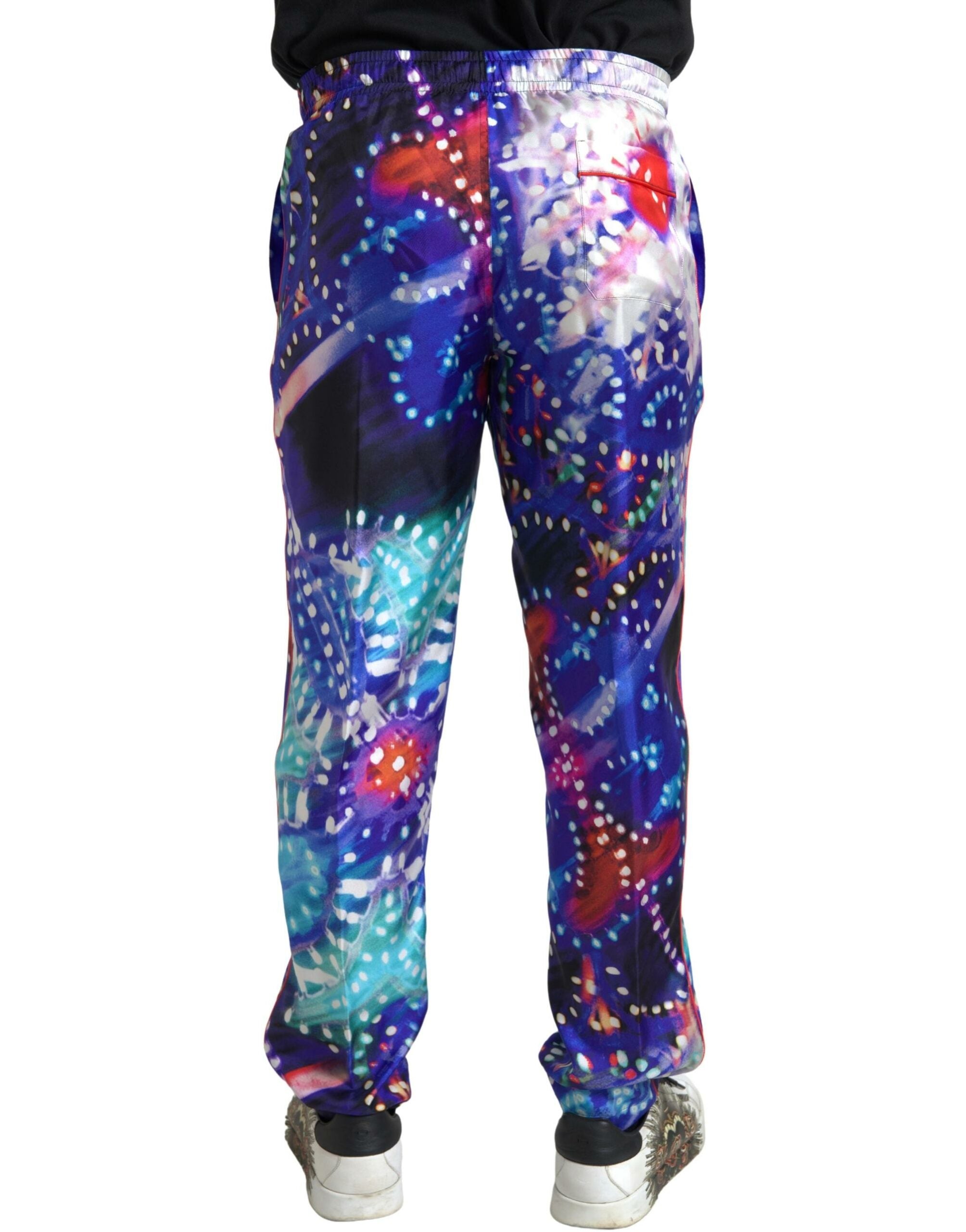 Multicolor printed silk men's trouser pants by Dolce & Gabbana, showing vibrant pattern and tailored fit.
