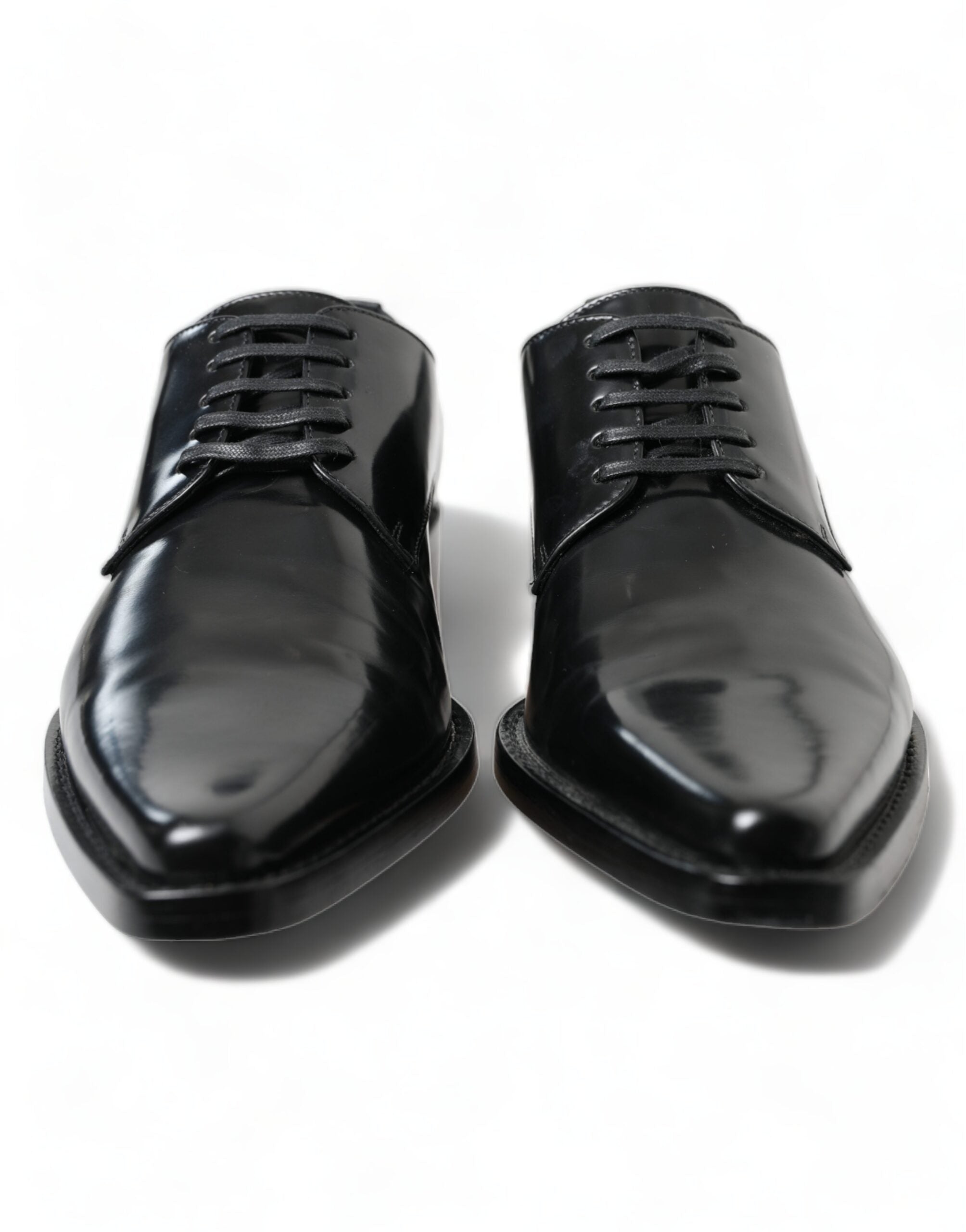 Black leather lace-up formal flats shoes by Dolce & Gabbana, featuring sleek design and elegant craftsmanship.