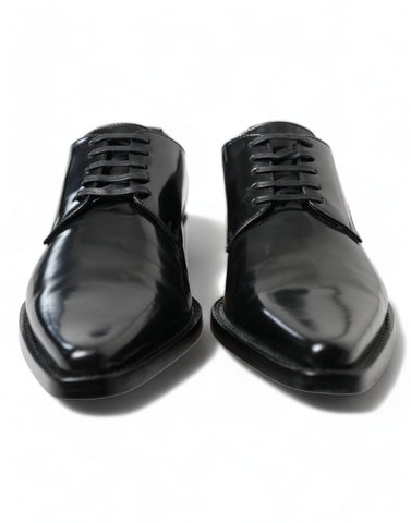 Black leather lace-up formal flats shoes by Dolce & Gabbana, featuring sleek design and elegant craftsmanship.