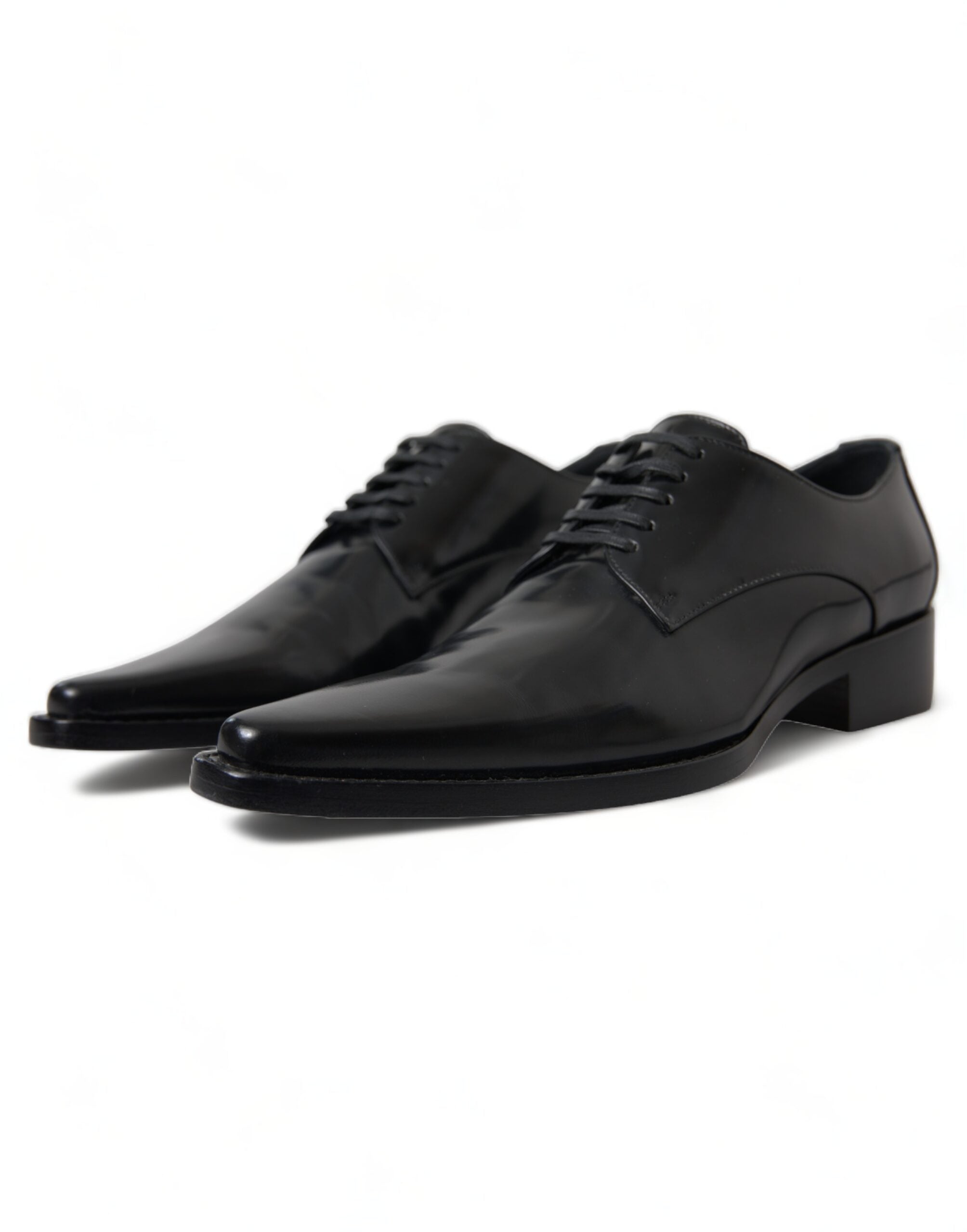 Black leather lace-up formal flats shoes by Dolce & Gabbana, featuring sleek design and polished finish.