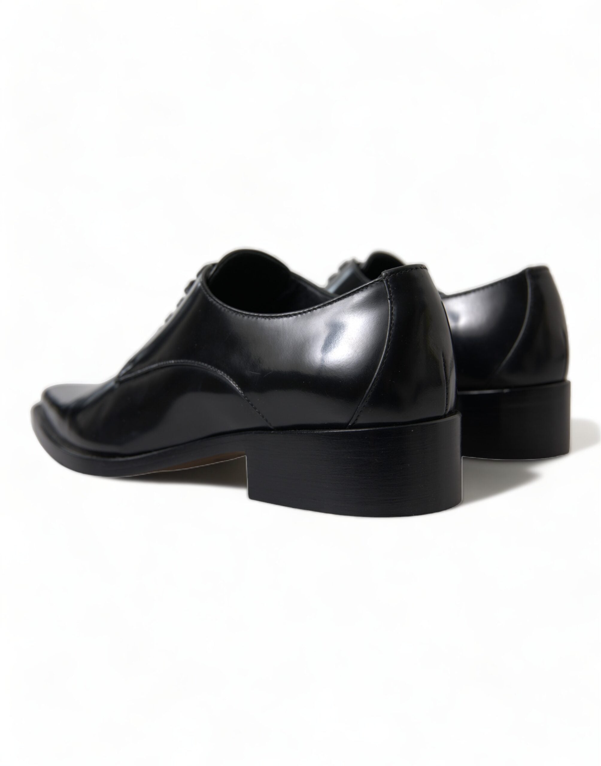 Black leather lace-up formal flats shoes by Dolce & Gabbana, featuring sleek design and elegant craftsmanship.